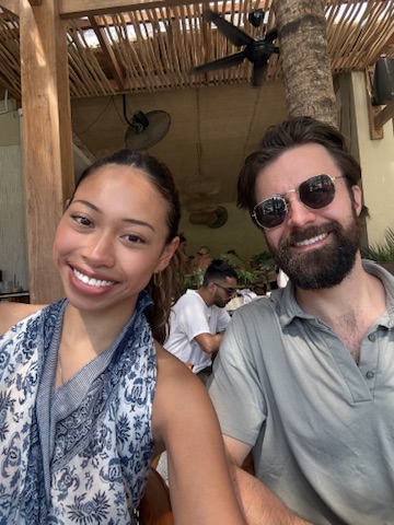 Michael and Deha eating together on their honeymoon