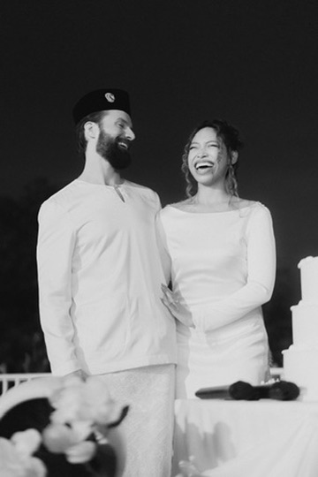 Michael and Deha laughing together at the wedding