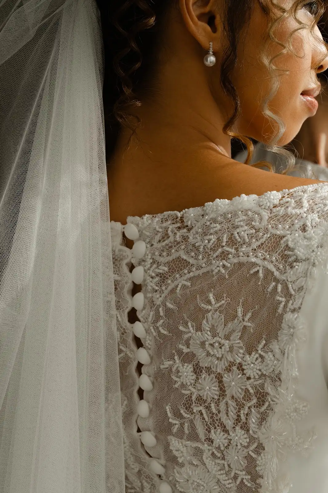 A detail from Deha’s white wedding attire