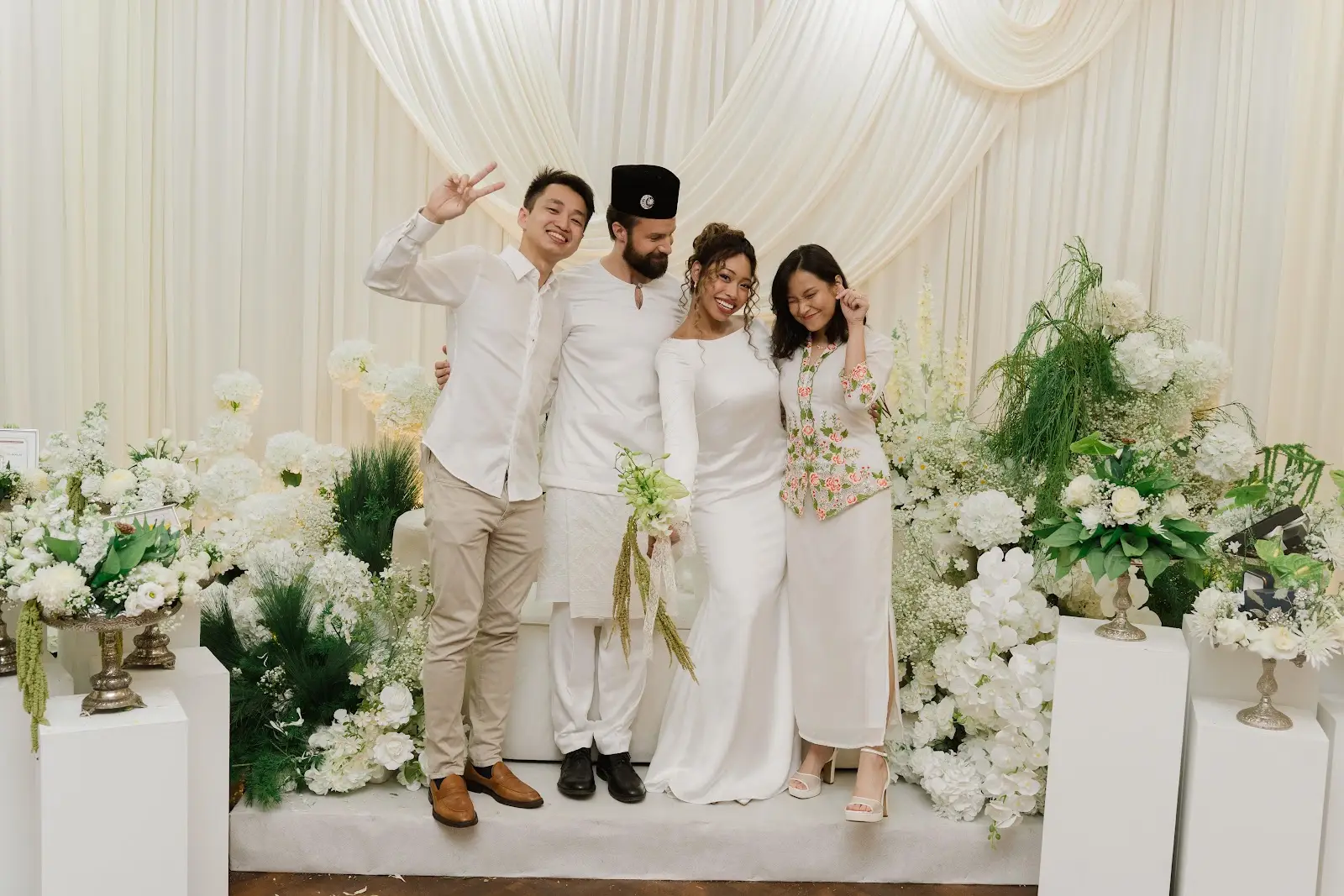 Michael and Deha with friends during the wedding celebrations