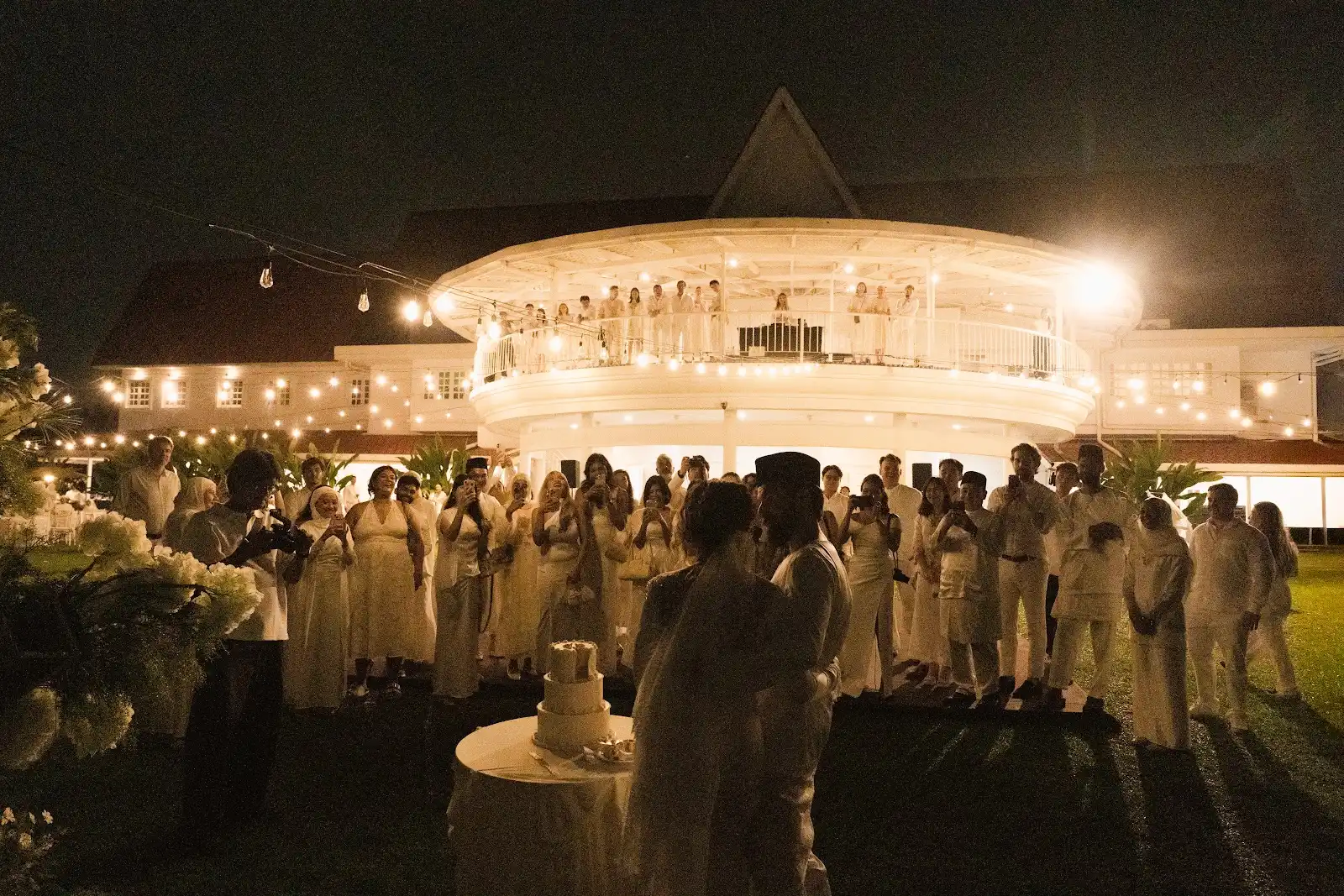 Michael and Deha celebrating with friends in the evening