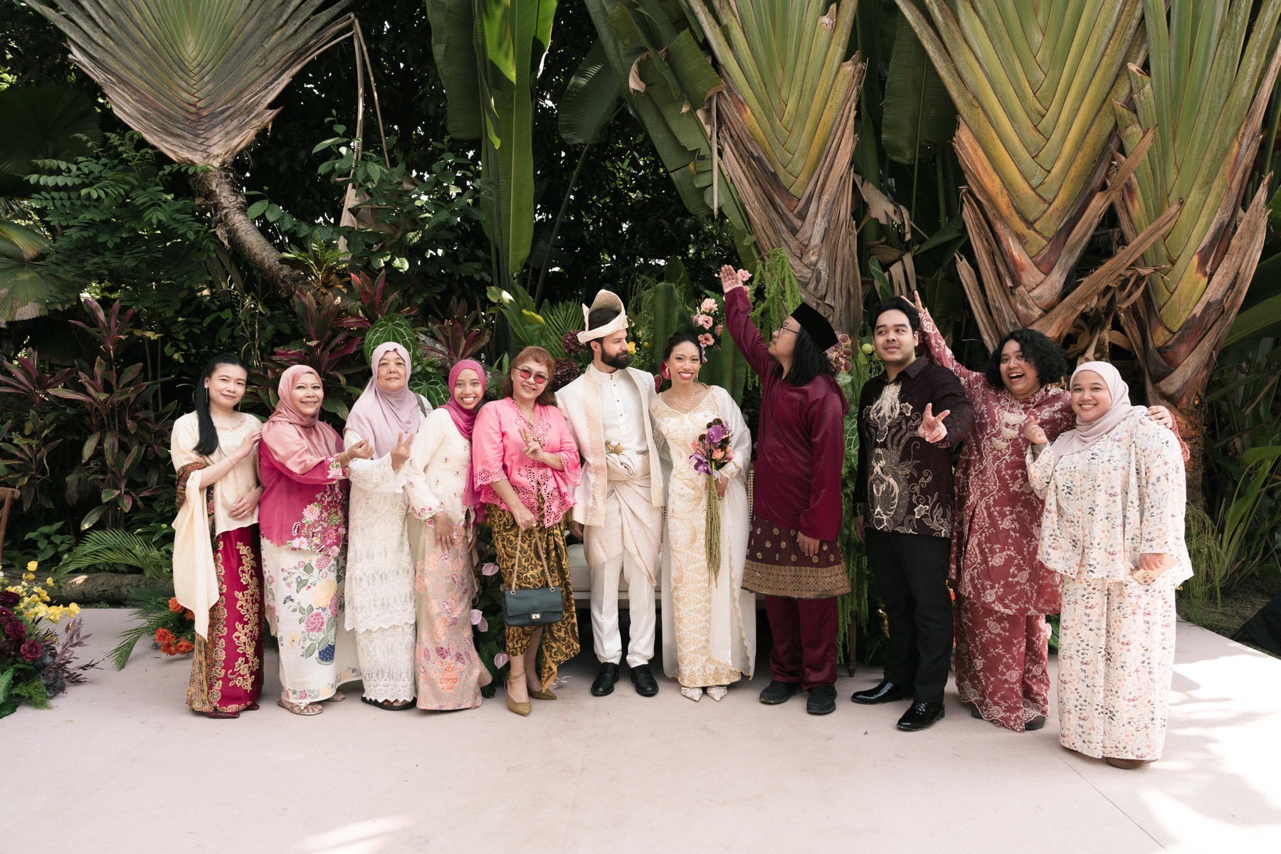 Deha and Michael with extended family during the Sanding celebration