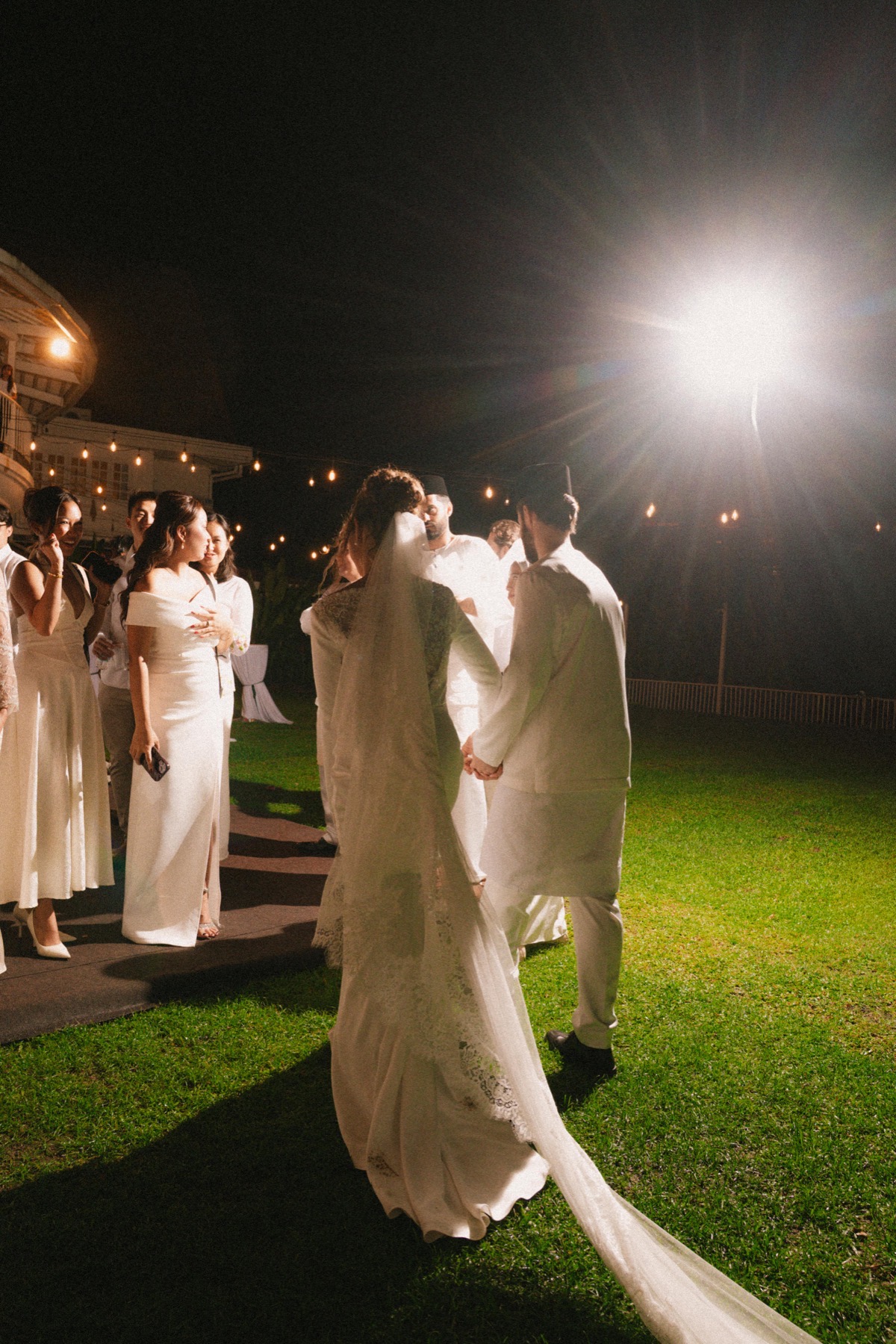 Michael and Deha walking together with friends after the evening ceremony