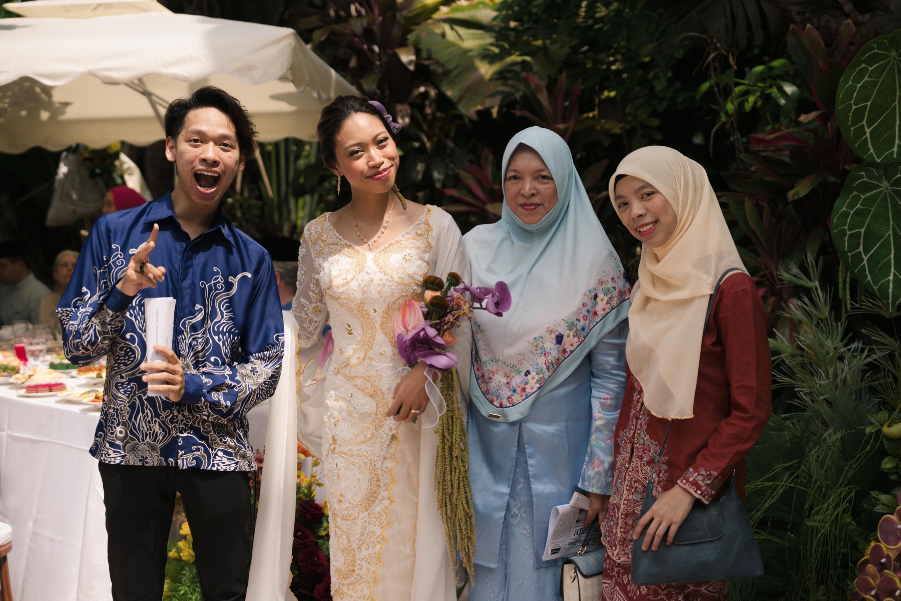 Michael with Deha, Ibu, and Najwa during the Sanding celebration